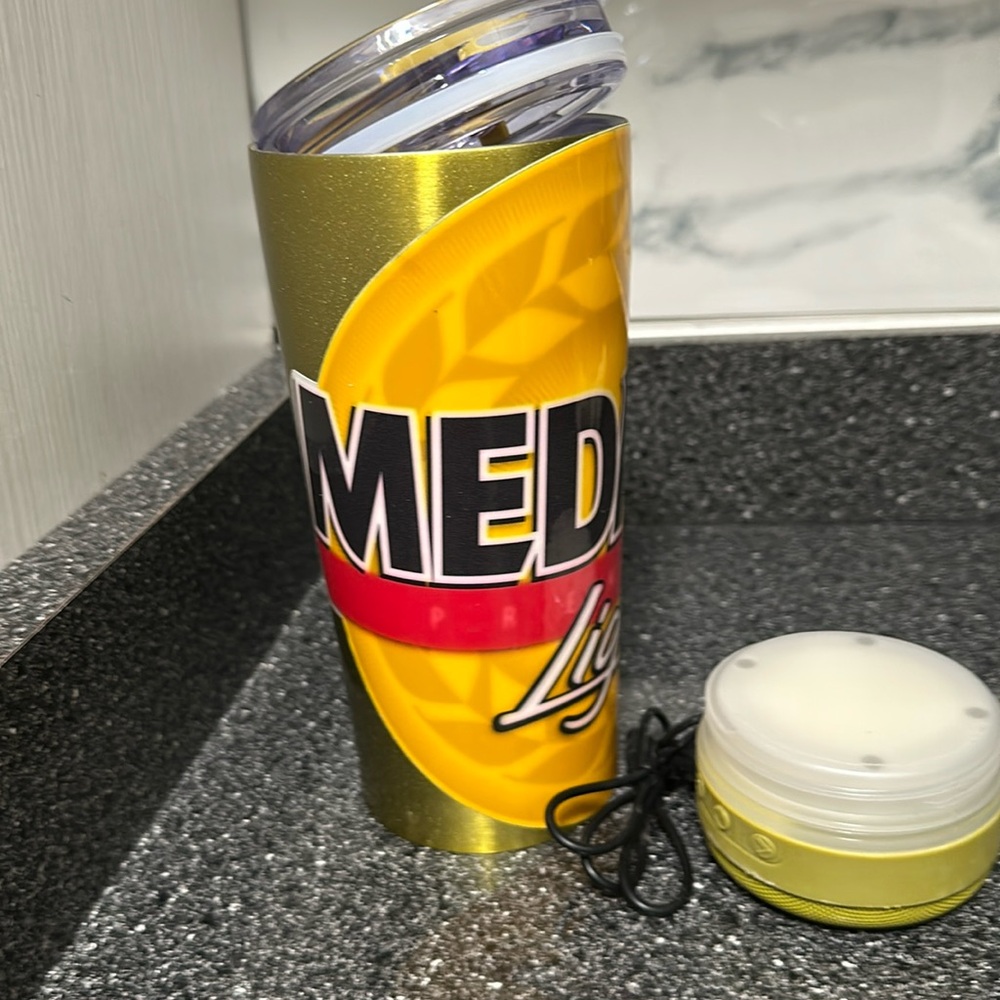 Tumbler with speaker wire and is a medalla light
